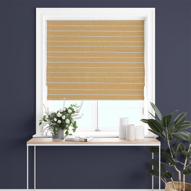 Close-up of ochre striped curtain fabric, highlighting its soft woven texture.