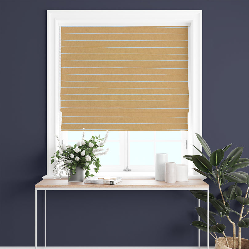 Close-up of ochre striped curtain fabric, highlighting its soft woven texture.