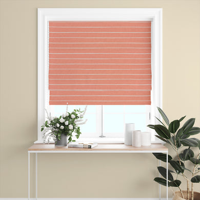 Close-up of peach striped curtain fabric with a delicate woven structure.