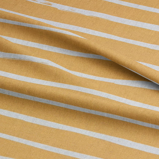 Golden-yellow striped curtain fabric from the Alcantara collection, perfect for creating inviting interiors.