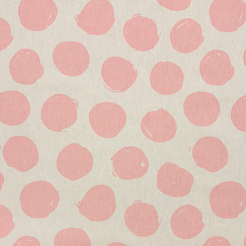 Arno Spot Blush curtain fabric with a soft pink polka dot pattern for a delicate touch.