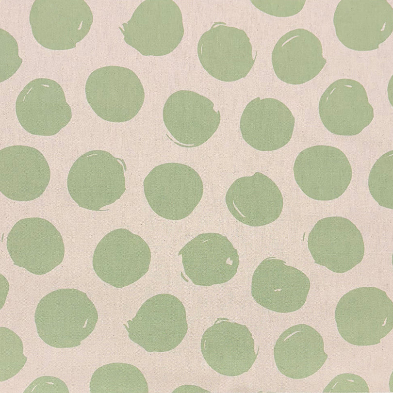 Arno Spot Lemongrass curtain fabric with a yellow-green polka dot pattern, ideal for fresh interiors.