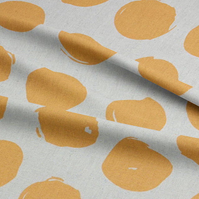 Spotted polka dot curtain fabric in Ochre, bringing a vintage-inspired aesthetic to your space.