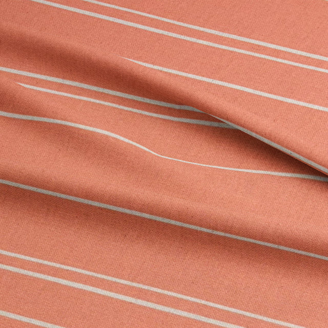 Close-up of Arroux peach striped upholstery fabric’s woven details