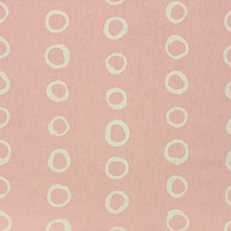 Calaggio Blush Spotty Polka Dot Curtain Fabric - Flat Sample showcasing a soft pink background with delicate off-white circular motifs.