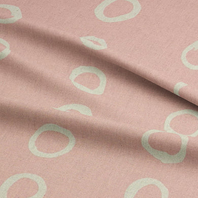 Calaggio Blush Spot Curtain Fabric - Draped Material displaying its lightweight drape and elegant polka dot pattern.