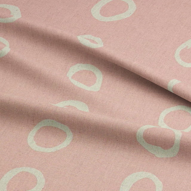 Calaggio Blush Spot Curtain Fabric - Draped Material displaying its lightweight drape and elegant polka dot pattern.