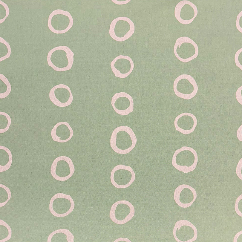 Calaggio Lemongrass Spotty Curtain Fabric - Flat View with a warm yellow-green hue and printed polka dots.