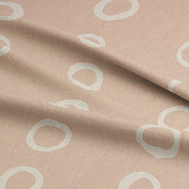 Calaggio Natural Spotty Polka Dot Fabric - Draped View showcasing its elegant flow and organic charm.