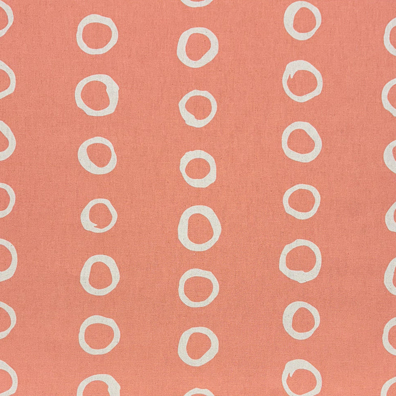 Calaggio Peach Spot Curtain Fabric - Flat Sample in a soft pastel peach with gentle polka dot accents.