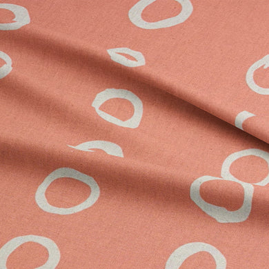 Calaggio Peach Spotty Curtain Fabric - Draped View highlighting its smooth texture and lightweight drape.