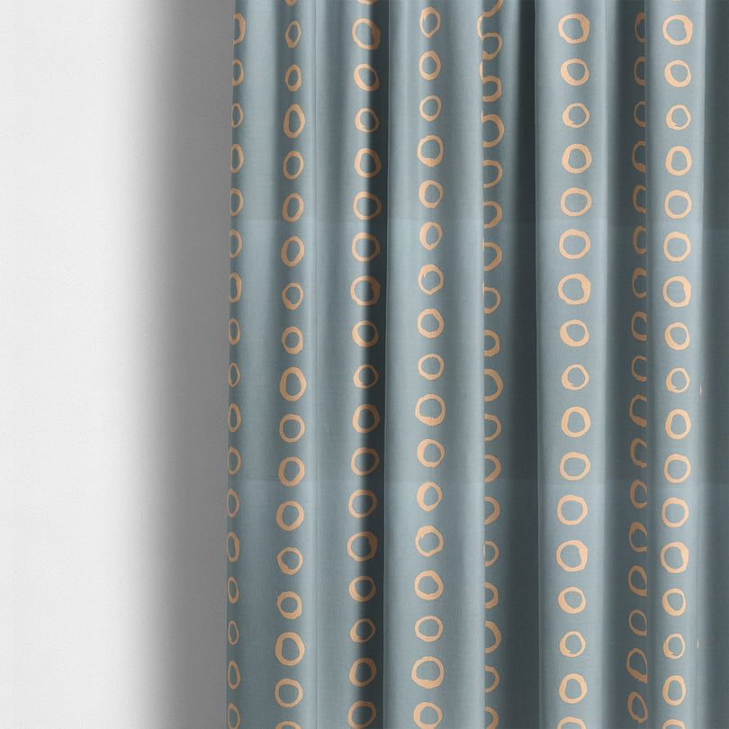 Calaggio Sky Spotty Curtain Fabric - Styled Room View featuring a modern interior with sky blue polka dot curtains.