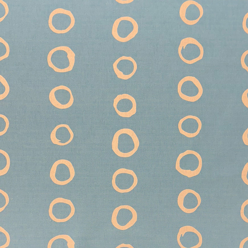 Calaggio Sky Polka Dot Curtain Fabric - Flat Sample in a soft blue hue with subtle, painterly polka dots.