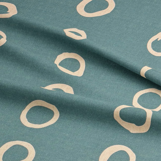 Calaggio Teal Spotty Polka Dot Fabric - Draped Sample showcasing its texture and elegant drape.