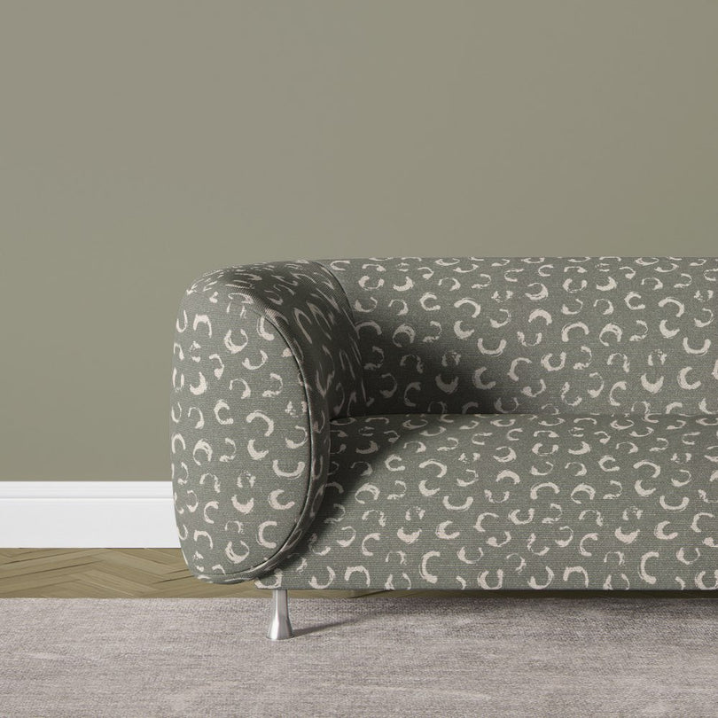 Durance fennel green printed fabric with unique abstract markings, adding a sophisticated touch to contemporary and classic interiors.