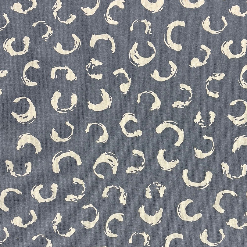 Navy blue printed upholstery fabric with a bold artistic design, making it a standout choice for statement sofas and chairs.