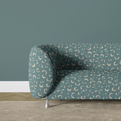 Durance teal printed fabric with organic print details, creating a striking yet versatile fabric for upholstered chairs and cushions.