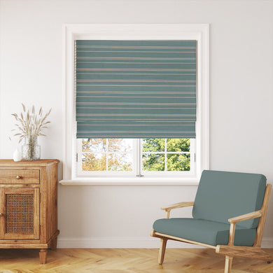 Gravina Teal striped fabric in a window blind, bringing a bold and stylish touch to a contemporary setting.