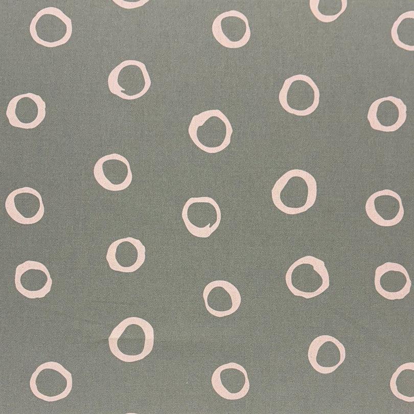 Limentra Fennel Spotted Curtain Fabric – a muted green polka dot fabric with a natural, organic feel.