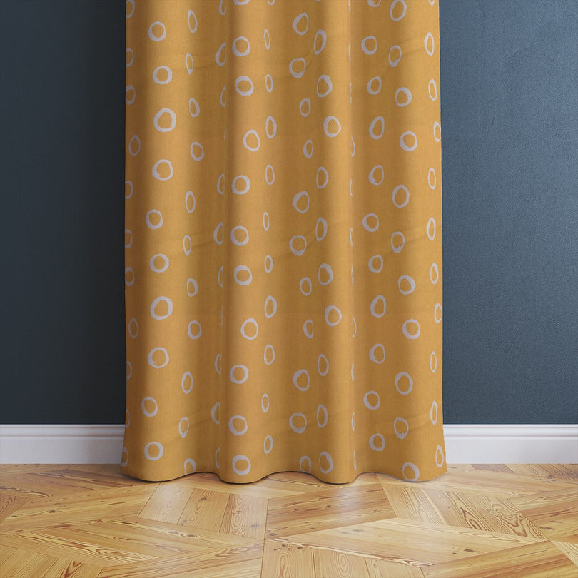 Limentra Ochre polka dot fabric – a vibrant yellow curtain fabric with a playful spotted pattern.