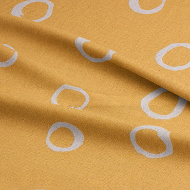 Ochre polka dot curtain fabric – a warm-toned spotted fabric perfect for rich, earthy interiors.