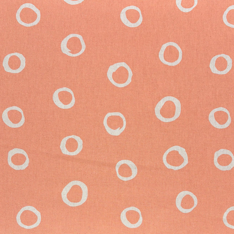 Limentra Peach Spotted Curtain Fabric – a soft orange polka dot fabric ideal for warm, inviting décor.