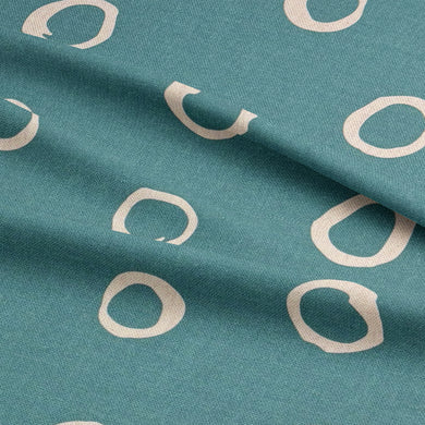 Teal polka dot curtain fabric – a statement spotted fabric perfect for unique window treatments.