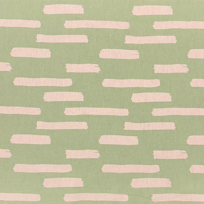 Liri Lemongrass curtain fabric featuring an abstract stripe pattern, perfect for fresh, modern interiors.