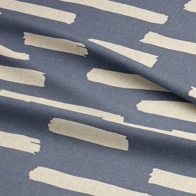 Navy Liri fabric for curtains, featuring an artistic stripe pattern for modern interiors.