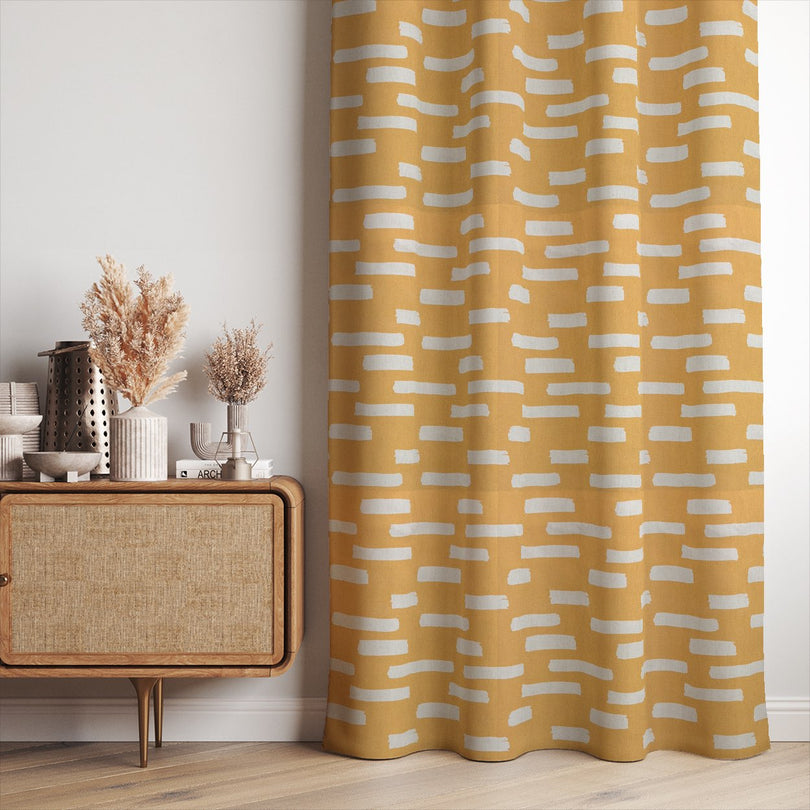 Liri curtain fabric in Ochre, a luxurious choice for statement curtains in any home.