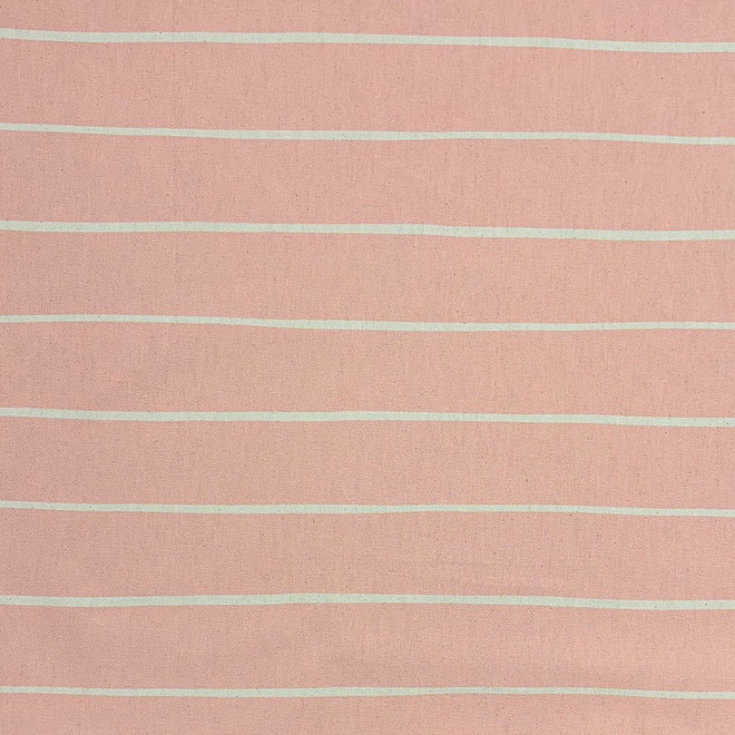 Blush striped upholstery fabric with a warm pastel tone, perfect for soft and inviting furniture pieces.